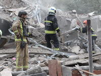 Rescuers work at the scene of an overnight Russian attack in the Novokadatskyi district of Dnipro, Ukraine, on October 25, 2024. NO USE RUSS...