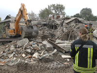 Rescuers work at the scene of an overnight Russian attack in the Novokadatskyi district of Dnipro, Ukraine, on October 25, 2024. NO USE RUSS...