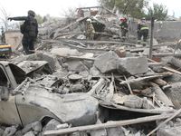 Rescuers work at the scene of an overnight Russian attack in the Novokadatskyi district of Dnipro, Ukraine, on October 25, 2024. NO USE RUSS...