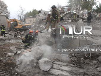 Rescuers work at the scene of an overnight Russian attack in the Novokadatskyi district of Dnipro, Ukraine, on October 25, 2024. NO USE RUSS...