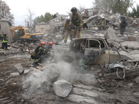 Rescuers work at the scene of an overnight Russian attack in the Novokadatskyi district of Dnipro, Ukraine, on October 25, 2024. NO USE RUSS...