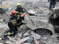 Rescuers work at the scene of an overnight Russian attack in the Novokadatskyi district of Dnipro, Ukraine, on October 25, 2024. NO USE RUSS...