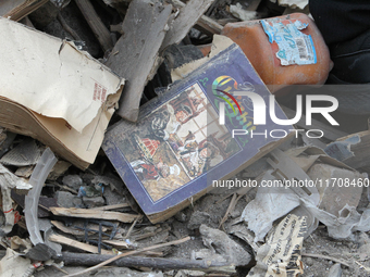 A book is on the ruins of a building destroyed by an overnight Russian attack in the Novokadatskyi district of Dnipro, Ukraine, on October 2...