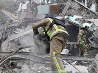 Rescuers work at the scene of an overnight Russian attack in the Novokadatskyi district of Dnipro, Ukraine, on October 25, 2024. NO USE RUSS...