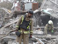 Rescuers work at the scene of an overnight Russian attack in the Novokadatskyi district of Dnipro, Ukraine, on October 25, 2024. NO USE RUSS...