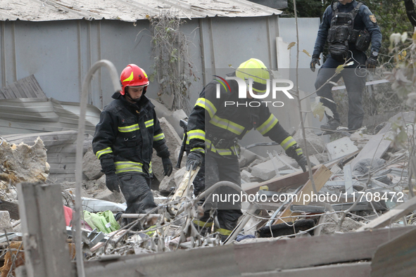 Rescuers work at the scene of an overnight Russian attack in the Novokadatskyi district of Dnipro, Ukraine, on October 25, 2024. NO USE RUSS...