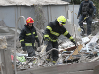 Rescuers work at the scene of an overnight Russian attack in the Novokadatskyi district of Dnipro, Ukraine, on October 25, 2024. NO USE RUSS...