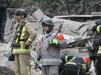 Rescuers work at the scene of an overnight Russian attack in the Novokadatskyi district of Dnipro, Ukraine, on October 25, 2024. NO USE RUSS...