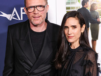 Paul Bettany and wife Jennifer Connelly arrive at the 2024 AFI Fest - World Premiere Screening Of Sony Pictures' 'Here' held at the TCL Chin...