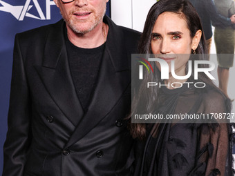 Paul Bettany and wife Jennifer Connelly arrive at the 2024 AFI Fest - World Premiere Screening Of Sony Pictures' 'Here' held at the TCL Chin...