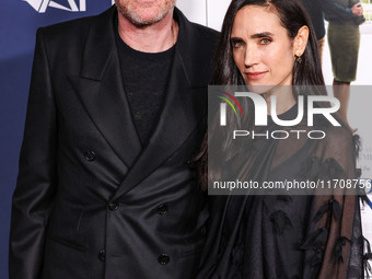 Paul Bettany and wife Jennifer Connelly arrive at the 2024 AFI Fest - World Premiere Screening Of Sony Pictures' 'Here' held at the TCL Chin...