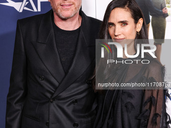 Paul Bettany and wife Jennifer Connelly arrive at the 2024 AFI Fest - World Premiere Screening Of Sony Pictures' 'Here' held at the TCL Chin...