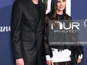 Paul Bettany and wife Jennifer Connelly arrive at the 2024 AFI Fest - World Premiere Screening Of Sony Pictures' 'Here' held at the TCL Chin...