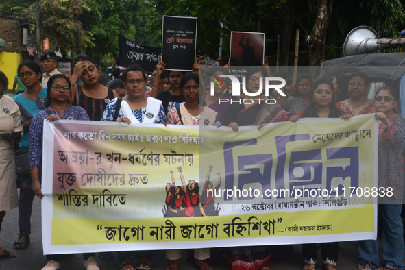 Female activists participate in a rally protest to condemn the rape and murder of a PGT Doctor as they shout slogans against the West Bengal...