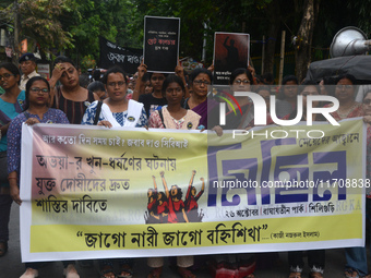 Female activists participate in a rally protest to condemn the rape and murder of a PGT Doctor as they shout slogans against the West Bengal...