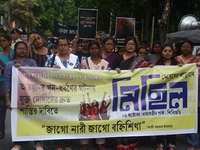 Female activists participate in a rally protest to condemn the rape and murder of a PGT Doctor as they shout slogans against the West Bengal...