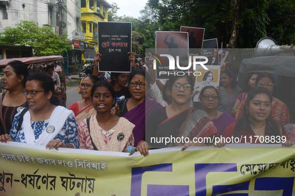 Female activists participate in a rally protest to condemn the rape and murder of a PGT Doctor as they shout slogans against the West Bengal...