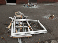 In Dnipro, Ukraine, on October 26, 2024, window frames are piled on the ground after a Russian strike on central Dnipro, east-central Ukrain...