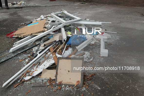 In Dnipro, Ukraine, on October 26, 2024, window frames are piled on the ground after a Russian strike on central Dnipro, east-central Ukrain...