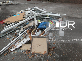 In Dnipro, Ukraine, on October 26, 2024, window frames are piled on the ground after a Russian strike on central Dnipro, east-central Ukrain...