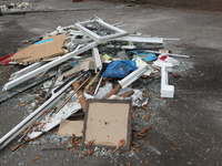 In Dnipro, Ukraine, on October 26, 2024, window frames are piled on the ground after a Russian strike on central Dnipro, east-central Ukrain...