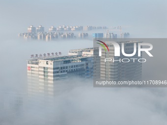 Buildings and real estate projects are seen in advection fog in Yantai, Shandong province, China, on October 26, 2024. (