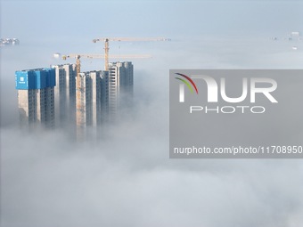 Buildings and real estate projects are seen in advection fog in Yantai, Shandong province, China, on October 26, 2024. (