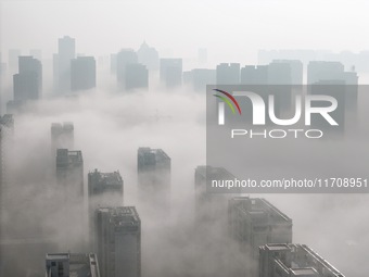 Buildings and real estate projects are seen in advection fog in Yantai, Shandong province, China, on October 26, 2024. (