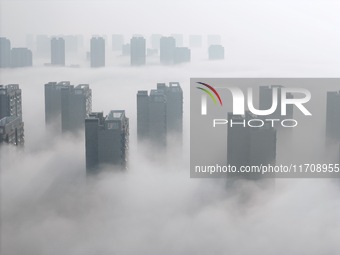 Buildings and real estate projects are seen in advection fog in Yantai, Shandong province, China, on October 26, 2024. (