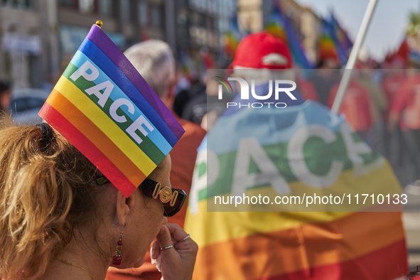 Thousands of people march through Bari, Italy, on October 26, 2024, with banners and flags during a peace rally titled ''Stop the wars, the...