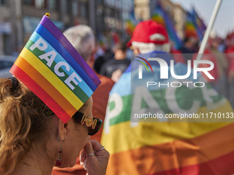 Thousands of people march through Bari, Italy, on October 26, 2024, with banners and flags during a peace rally titled ''Stop the wars, the...