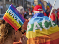 Thousands of people march through Bari, Italy, on October 26, 2024, with banners and flags during a peace rally titled ''Stop the wars, the...