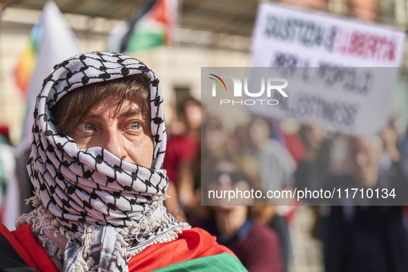 Thousands of people march through Bari, Italy, on October 26, 2024, with banners and flags during a peace rally titled ''Stop the wars, the...