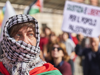 Thousands of people march through Bari, Italy, on October 26, 2024, with banners and flags during a peace rally titled ''Stop the wars, the...