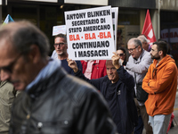 Thousands of people march through Bari, Italy, on October 26, 2024, with banners and flags during a peace rally titled ''Stop the wars, the...