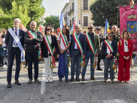 Thousands of people march through Bari, Italy, on October 26, 2024, with banners and flags during a peace rally titled ''Stop the wars, the...