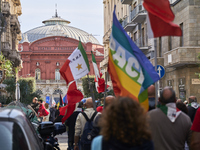 Thousands of people march through Bari, Italy, on October 26, 2024, with banners and flags during a peace rally titled ''Stop the wars, the...