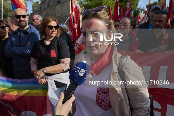 Gigia Bucci, General Secretary of CGIL Puglia, speaks at a rally advocating for world peace in Bari, Italy, on October 26, 2024. Thousands o...