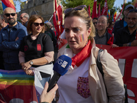 Gigia Bucci, General Secretary of CGIL Puglia, speaks at a rally advocating for world peace in Bari, Italy, on October 26, 2024. Thousands o...