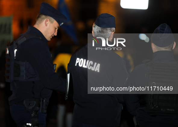 Police attend a protest against Jaroslaw Kaczynski's monthly visit to Wawel Hill in Krakow, Poland, on October 18, 2024. Every 18th day of t...