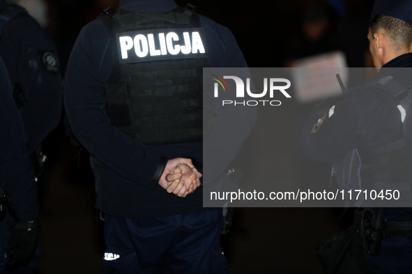 Police attend a protest against Jaroslaw Kaczynski's monthly visit to Wawel Hill in Krakow, Poland, on October 18, 2024. Every 18th day of t...