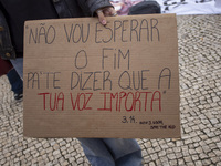 Demonstrators march holding banners in Lisbon, Portugal, on October 26, 2024. They protest the death of Cape Verdean immigrant Odair Moniz,...