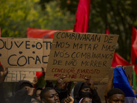 Demonstrators march holding banners in Lisbon, Portugal, on October 26, 2024. They protest the death of Cape Verdean immigrant Odair Moniz,...