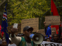 Demonstrators march holding banners in Lisbon, Portugal, on October 26, 2024. They protest the death of Cape Verdean immigrant Odair Moniz,...