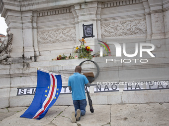 In Lisbon, Portugal, on October 26, 2024, a man prays before an improvised memorial with the picture of Odair Moniz at Praca dos Restaurador...