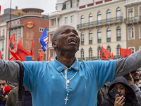 In Lisbon, Portugal, on October 26, 2024, a man cries after praying before an improvised memorial with the picture of Odair Moniz at Praca d...