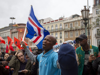 In Lisbon, Portugal, on October 26, 2024, a man cries after praying before an improvised memorial with the picture of Odair Moniz at Praca d...