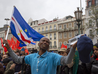 In Lisbon, Portugal, on October 26, 2024, a man cries after praying before an improvised memorial with the picture of Odair Moniz at Praca d...