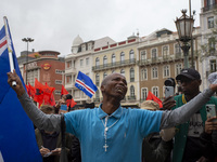 In Lisbon, Portugal, on October 26, 2024, a man cries after praying before an improvised memorial with the picture of Odair Moniz at Praca d...