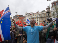 In Lisbon, Portugal, on October 26, 2024, a man cries after praying before an improvised memorial with the picture of Odair Moniz at Praca d...